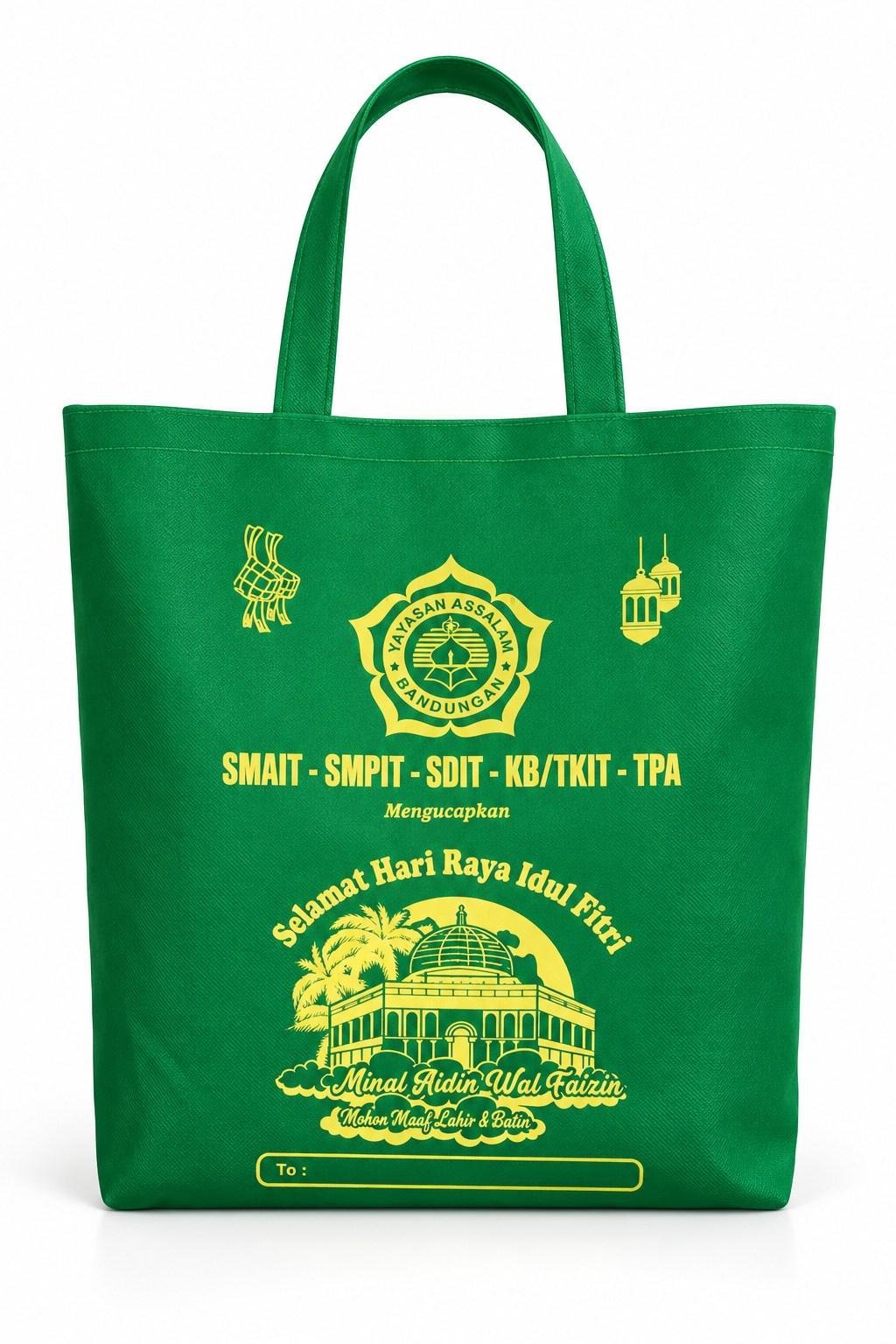 Tas spunbond hijau dengan sablon kuning bertema Idulfitri